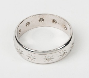 An 18ct white gold eternity ring, set with white diamonds, stamped "750", 6.6 grams