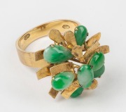 An 18ct gold and jade cocktail ring, stamped "18k", ​​​​​​​6.8 grams