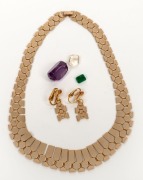 Three assorted loose cut stones, together with a silver and gilt finish necklace and earrings