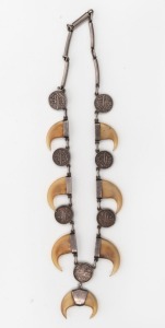 An Indo-Persian tiger claw and silver coin necklace, 47cm long