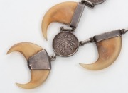 An Indo-Persian&nbsp;tiger claw and silver coin necklace, 47cm long - 2