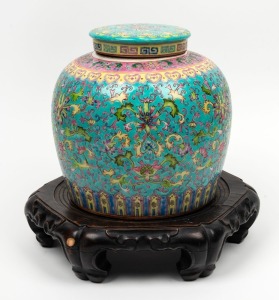 A Chinese export ware lidded ginger jar with unassociated antique carved timber base, 19th/20th century, (2 items), ​​​​​​​the jar 24cm high