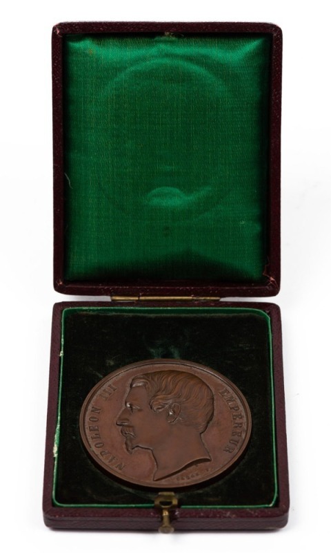 EXPOSITION DE L'AGRICULTURE ET DE L'INDUSTRIE - NAPOLEON III bronze medal, the Emperor's bust facing left (by Caque); with details of the award on reverse for the "ILE DE LA REUNION" exhibit; 50mm in fitted push button case with silk and velvet interior.