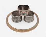 A vintage Continental silver necklace with gilt finish, a sterling silver and floral enamel napkin ring, together with a pair of silver plated napkin rings, (4 items)