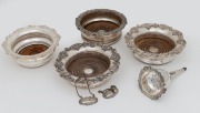 Antique silver plated wine funnel, four assorted wine bottle coasters and a pair of sterling silver decanter labels, 19th/20th century, (7 items), the funnel 15cm high