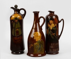Three ROYAL DOULTON KINGSWARE&nbsp;whisky flagons, including Churchwarden and Nightwatchman examples, one with original stopper, 20th century, black factory mark to bases, the largest 28cm high