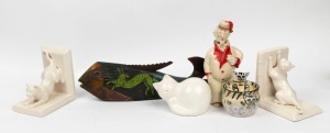 Ceramic cat bookends, cat statue, cat decorated sugar bowl, porcelain figural decanter, and a hand-painted carved wooden fish ornament, 20th century, (6 items), the decanter 24cm high