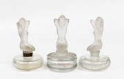 ISADORA group of three French glass perfume bottles with figural nude kneeling tops, mixed vintages, 11cm high