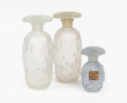 MARC ISANBEL "BERYLUNE" group of three French frosted glass perfume bottles in two sizes, the smaller example&nbsp;with blue patinated finish and&nbsp;bearing original label, 12cm and 7cm high