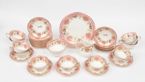 ROYAL WORCESTER English porcelain tea ware with pink floral border, made for the owners of the "TIGER BALM" company and bearing their famous leaping tiger crest, mid 20th century, (40 items)