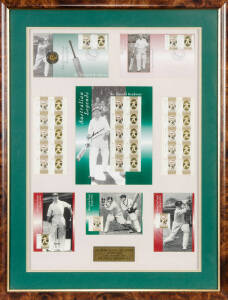 DON BRADMAN, signature on display of inaugural Australian Legends stamps, comprising FDC, Coin FDC, P.O.Pack (signed), stamp sheetlets & maxi cards; window mounted, framed and glazed, overall 55x71cm.