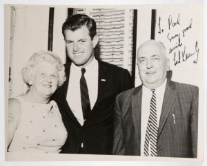 TED KENNEDY signature in black ink on black and white photograph. 23 x 18cm overall. 