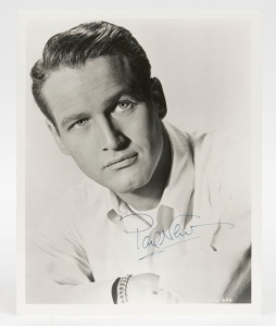 PAUL NEWMAN signature in blue ink on black and white photograph, ​​​​​​​25 x 20cm overall.