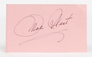 MAE WEST signature in black felt tip pen on pink paper. 14 x 8.5cm overall. 