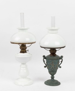 Two antique Bismarck style oil lamps, one in milk glass with single burner and the other with milk glass shade on cast metal vase base and single burner, 19th/20th century, the larger 52cm high overall