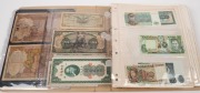 An ex-dealer's unorganized counter display book of World banknotes, including Vietnam, China, Japanese Occupations, Hungary, Cambodia, French Colonies, Chile, Argentina, Italy, Paraguay, Russia, and many more. Will take time to check. (150+).
