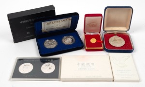 Several Chinese medallions and coins in presentation boxes; also a Wesley College Art award by Stokes.