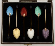 A set of six English sterling silver and enamel coffee spoons, in original plush fitted box, the box 15cm wide