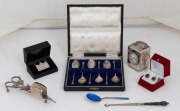 Boxed set of six sterling silver seal top spoons, together with a sterling silver cased clock, a silver and blue enamel spoon, boot hook, silver plated candle snuff, silver brooch and pair of earrings, 19th and 20th century, (7 items)
