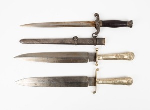 Three assorted hunting knives, one example with original metal scabbard and the other two exampled with acid etched blades, the largest 40cm long