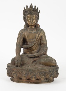 A Tibetan seated Buddha statue, cast bronze inset with coral, 19th/20th century, 27cm high