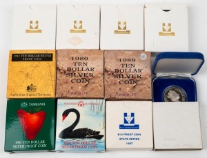 1984 $1 Proofs (4); 1988 50c Proof; and $10 Proofs 1987, 1989 (2), 1990, 1991 and 1993. (Total: 11, in boxes of issue).