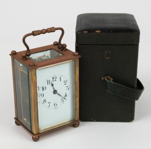 An antique French carriage clock with enamel dial and Arabic numerals, housed in original green leather travel case, 19th century, 13.5cm high overall
