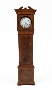 An antique pocket watch stand in the form of a grandfather clock; together with an antique silver cased pocket watch, 19th century, 31cm high
