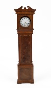 An antique pocket watch stand in the form of a grandfather clock; together with an antique silver cased pocket watch, 19th century, ​​​​​​​31cm high