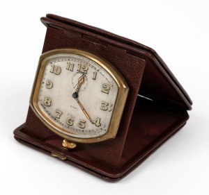 CYMA attractive vintage Swiss travel clock in original brown folding wallet, early 20th century, the wallet 11cm high