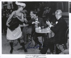 FRANK SINATRA: A publicity still from the film "Can-Can" (20th Century Fox, 1960) signed in felt-tipped pen by Sinatra, who is depicted in a scene with his co-stars, Juliet Prowse and Maurice Chevalier. 21 x 25cm overall