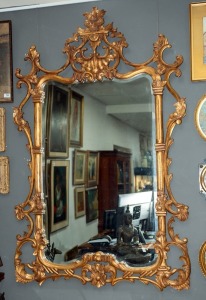 A Louis XV style giltwood wall mirror with ornate floral-carved and scrolled frame, 20th century, 155 x 99cm