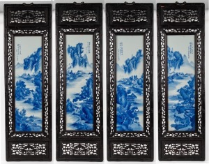 A set of four Chinese blue and white porcelain panels in ebonized timber frames, 20th century, 121 x 36cm each overall