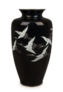 A Japanese silver finish cloisonne vase with flying cranes on black ground, Showa period, 20th century, 31cm high