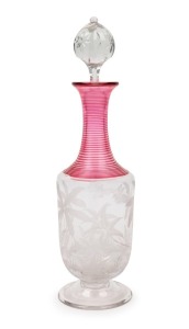 An antique decanter with ruby trailing glass decoration and fine intaglio cut butterfly and fern motif, 19th century, 27cm high