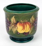 MOORCROFT&nbsp;fruit patterned jardiniere with green ground, late 20th century, factory mark to base, ​​​​​​​17.5cm high - 2