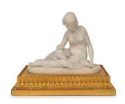 An antique carved marble statue of a reclining lady, mounted on carved gilt wood stand, 19th century,the statue 21cm high, 26cm wide,