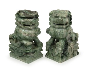 A pair of Chinese carved jade foo dog statues, 20th century, 17cm high