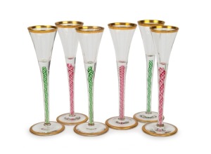 A set of six schnapps glasses with green and red double air twist stems, 15.5cm high