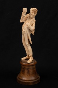 An antique Dieppe ivory statue, mounted on a turned treen plinth, 19th century, ​​​​​​​17.5cm high overall