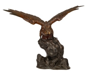 An antique Japanese bronze statue of a rising eagle, Meiji Period, 19th/20th century, made in section for transportation, 59cm high, 70.5cm wingspan