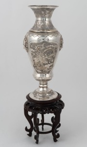 An antique Chinese export silver plated vase with dragon decoration, together with a carved wooden stand, 19th/20th century, 34cm high
