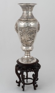 An antique Chinese export silver plated vase with dragon decoration, together with a carved wooden stand, 19th/20th century, ​​​​​​​34cm high