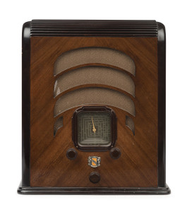 LEKMEK tombstone mantle radio in walnut case with brown bakelite knobs, 39cm high, 34cm wide