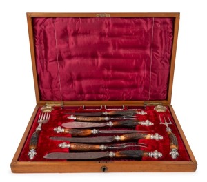 An antique boxed carving service with horn handles and silver plated mounts, impressively displayed in plush fitted walnut canteen, 19th century, 57cm wide
