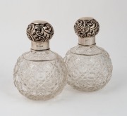 A pair of sterling silver and hobnail cut crystal bottles, made in Birmingham, circa 1912, ​​​​​​​14cm high