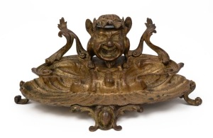 An antique French bronze inkwell desk piece with unusual grotesque figural adornment, 19th century, 28cm wide