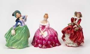 ROYAL DOULTON three porcelain figures of ladies, comprising "Autumn Breezes" (HN 1913); "Victoria" (HN 2471) and "Top O' The Hill" (HN 1834), the largest 18cm high