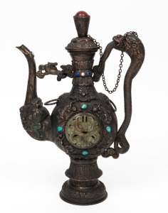 A Tibetan repousse copper teapot with carved green jade panels and inlaid with turquoise, lapis lazuli, and semi-precious stones, 20th century, ​​​​​​​31cm high