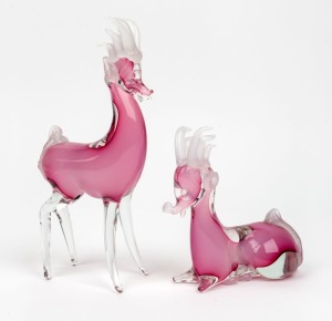 Two pink and opaque Murano glass deer statues, the larger 26cm high